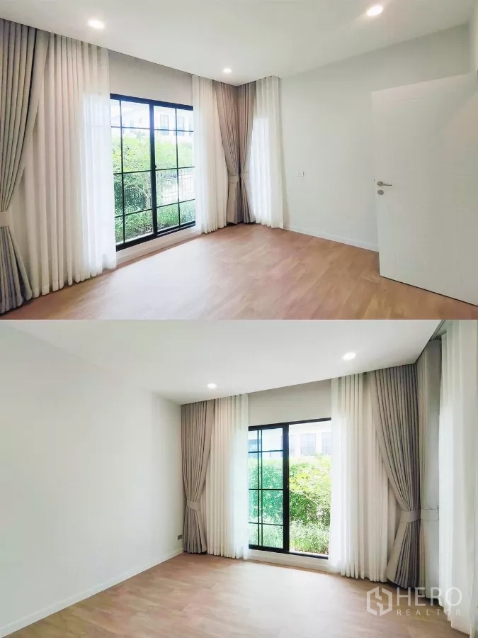 Detached House for rent in Khan Na Yao, Bangkok - Ground-floor multipurpose room with large windows, curtains and garden view.