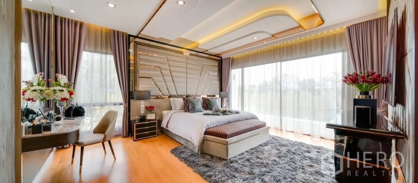 Detached House for rent in Prawet, Bangkok - Expansive master bedroom with statement headboard, cove lighting and wall-wide windows