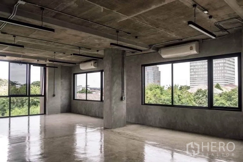 Home Office for rent or sale in Lak Si, Bangkok - Rooftop terrace with city views, outdoor chairs and safety railing.