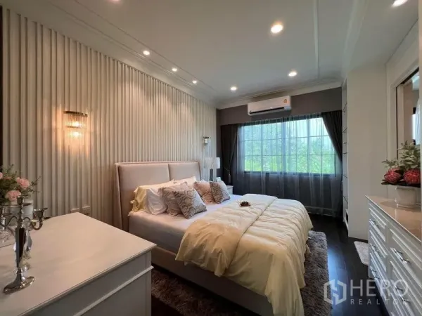 Detached House for sale in Yan Nawa, Bangkok - Cozy guest bedroom with paneled feature wall, large window and soft lighting.