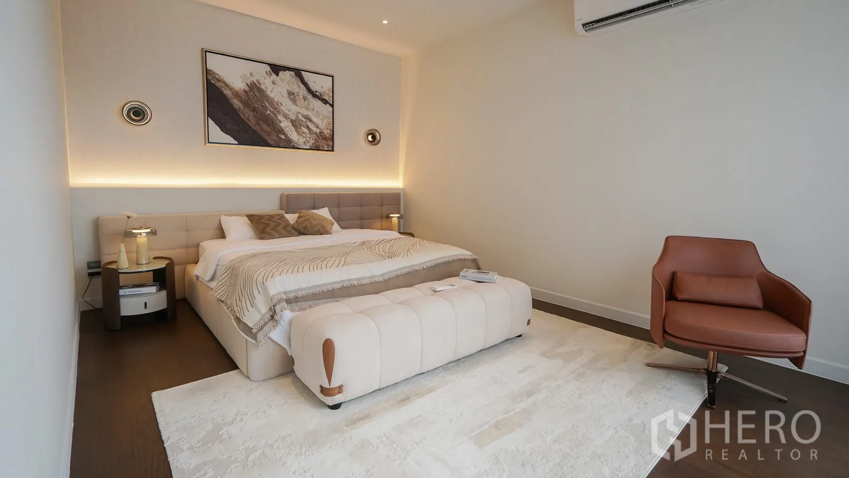 Detached House for rent or sale in Bang Kapi, Bangkok - Bright bedroom corner with modern armchair beside tall window.