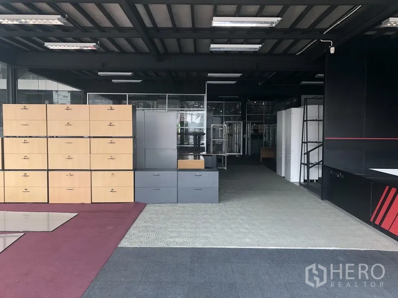 Retail Space for rent in Lam Luk Ka, Pathum Thani - Open-plan ground-floor showroom with display cabinets and shelving units.