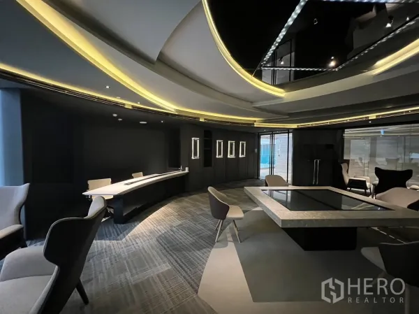 Retail Space for rent in Watthana, Bangkok - Contemporary retail space featuring cove lighting, dark accent walls, a long service counter and a central presentation table.