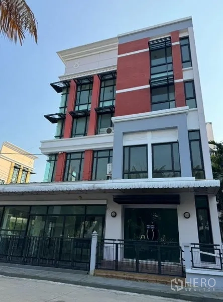 Office Space for rent in Bang Kho Laem, Bangkok - Front elevation of a modern office block featuring large windows and metal awnings.