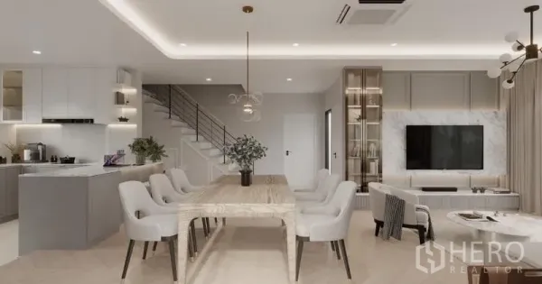 Detached House for rent in Bang Phli, Samut Prakan - Open-plan living, dining and kitchen with marble TV wall, wood table and staircase in neutral tones.