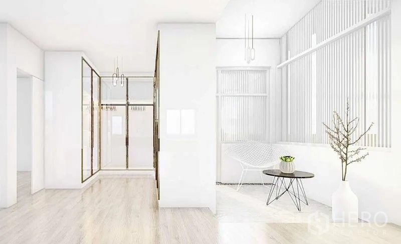 Detached House for rent in Lat Phrao, Bangkok - Airy hallway and sitting nook with floor-to-ceiling windows, light wood flooring and minimalist decor.
