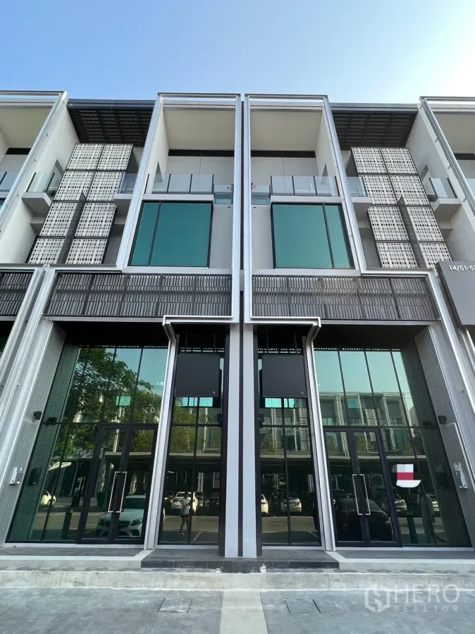 Home Office for rent in Bang Phli, Samut Prakan - Contemporary three‑storey home office with floor‑to‑ceiling glass facade and twin entrances.