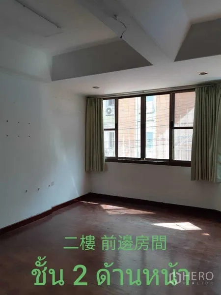 Townhouse for rent in Watthana, Bangkok - Bright bedroom with large window and curtains.
