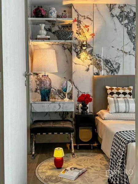 Condominium for rent - Bedroom entry showing marble shelving, decorative lamp and soft lighting beside the bed.