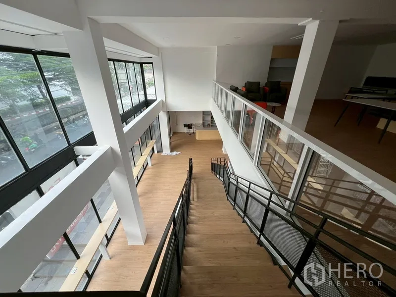 Retail Space for rent in Watthana, Bangkok - Staircase linking ground floor to mezzanine in a bright double-volume space.