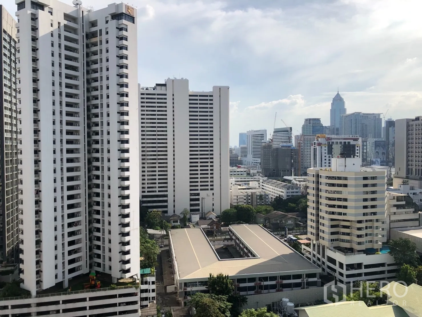 Condominium for rent in Bangkok - High-floor balcony view of Sukhumvit skyline and neighboring towers.