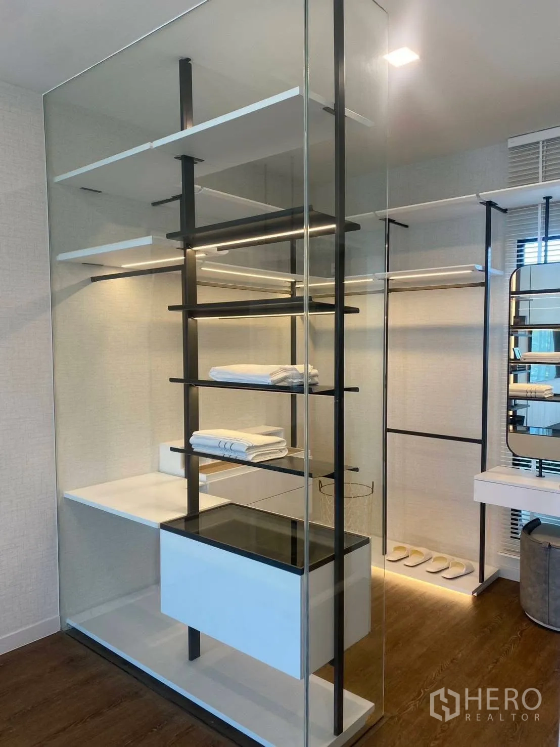 Detached House for rent or sale in Bang Phli, Samut Prakan - Glass-enclosed walk-in closet with open shelving and hanging rails.