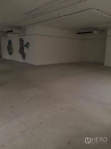 Retail Space for rent in Watthana, Bangkok - Large secondary area with high ceiling and AC units, ideal for stock or back office.