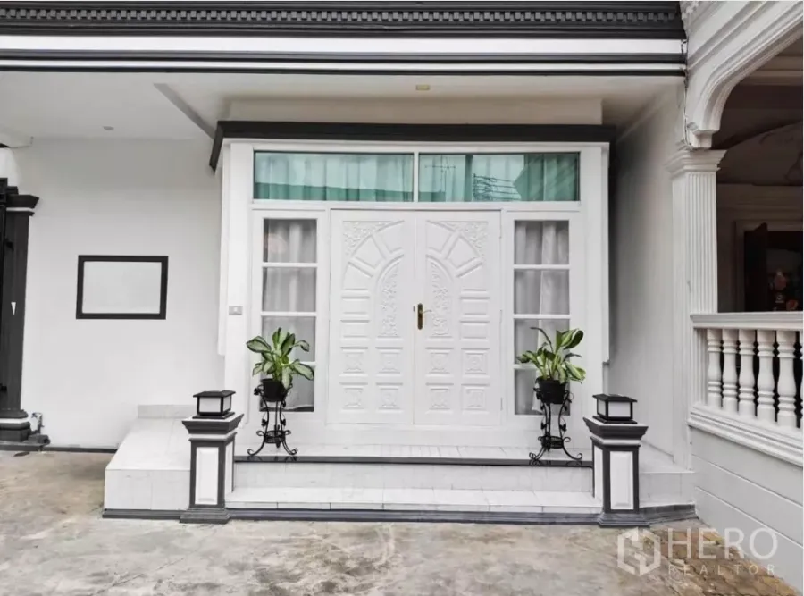 Detached House for rent in Yan Nawa, Bangkok - Front entrance of the house with ornate white double doors, steps, and planters.