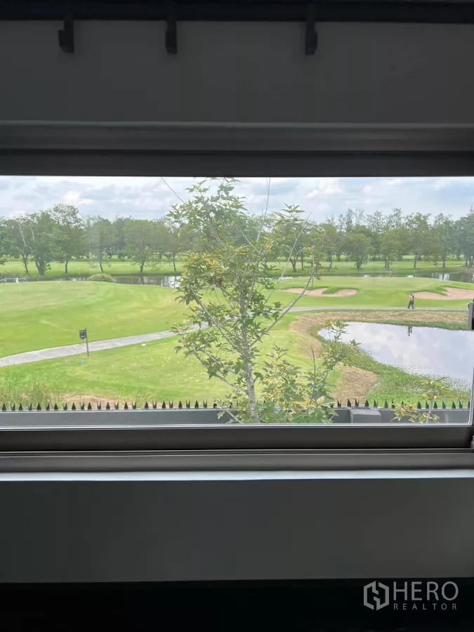 Detached House for rent in Saphan Sung, Bangkok - Window view across the Krungthep Kreetha golf course with pond and fairways.