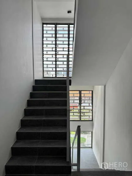 Home Office for rent or sale - Modern stairwell with dark steps and floor-to-ceiling louvered windows bringing natural light.