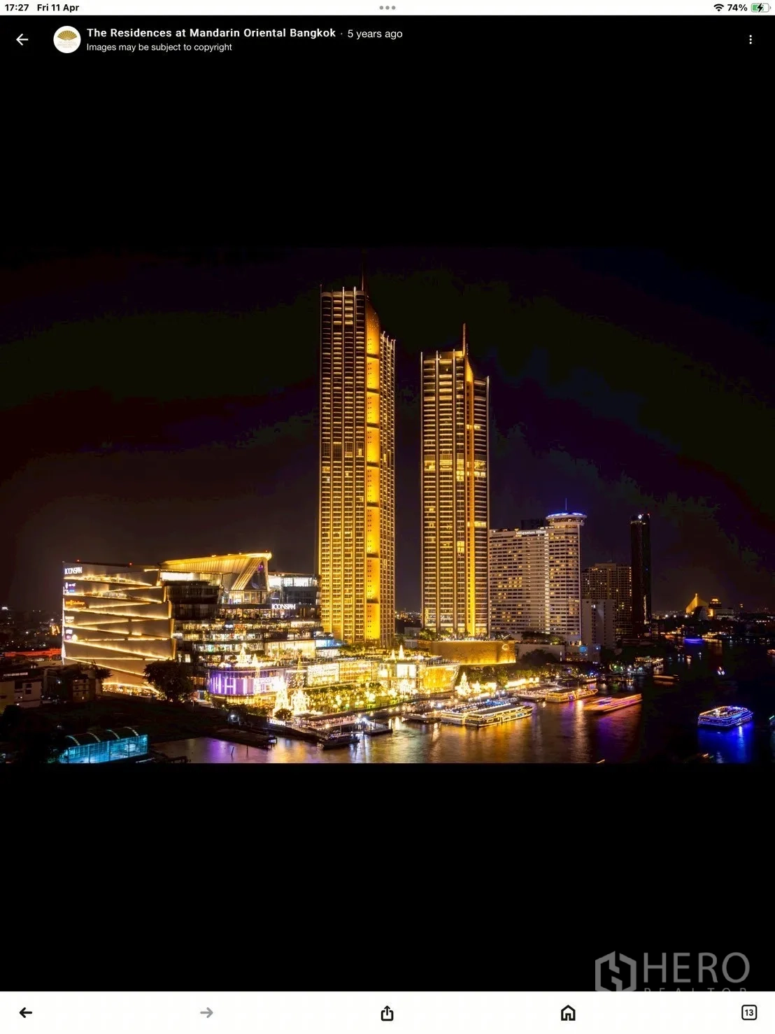 公寓 出租在Khlong San, Bangkok - 夜色中明亮的河畔高层综合体，临湄南河。
