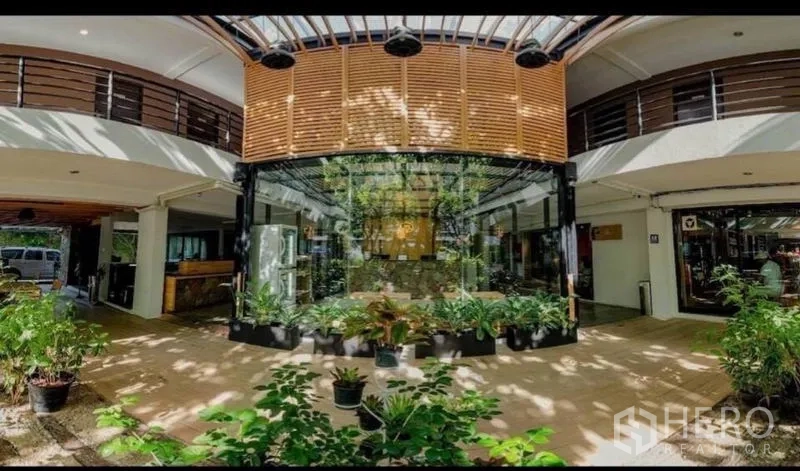 Retail Space for sale in Phra Nakhon, Bangkok - Ground-floor atrium lobby with glass storefront and potted plants.