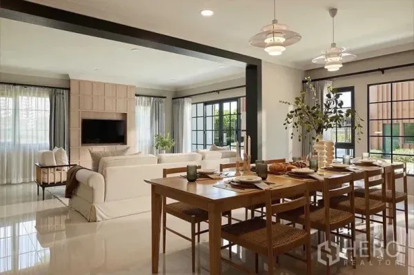 Detached House for sale in Bang Phli, Samut Prakan - Open-plan dining and living area with large windows, soft neutral décor and glossy tiled floors.