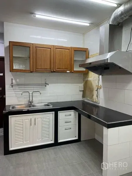 Retail Space for rent in Watthana, Bangkok - Compact pantry with tiled walls, stainless sink, range hood and wooden overhead cabinets.