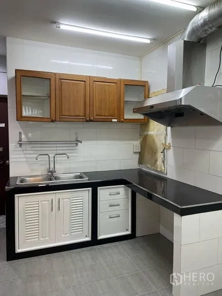 Retail Space for rent in Watthana, Bangkok - Compact pantry with tiled walls, stainless sink, range hood and wooden overhead cabinets.
