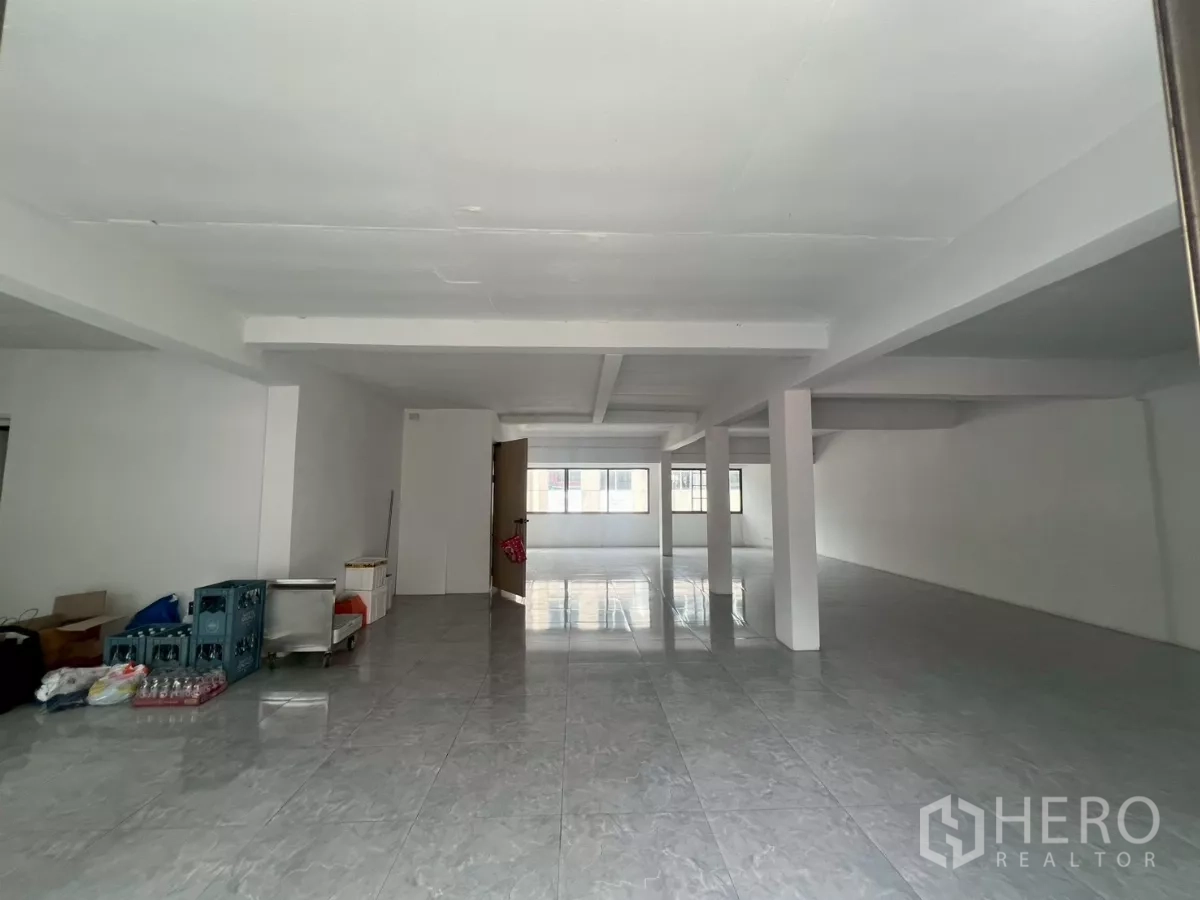 Retail Space for rent in Pathum Wan, Bangkok - Long open hall with support columns and tiled flooring for flexible layouts.