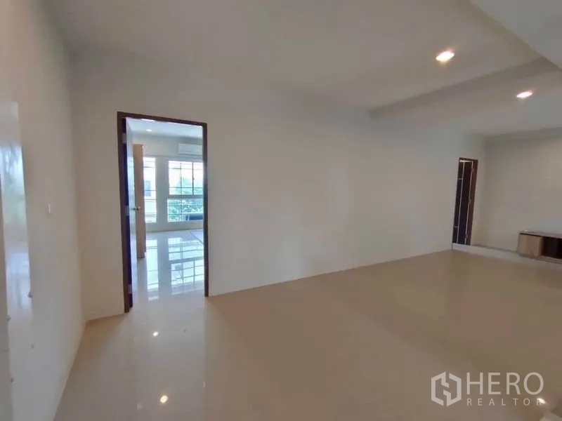 Home Office for rent or sale in Bang Na, Bangkok - Open workspace with doorway to a private room and big windows bringing natural light.