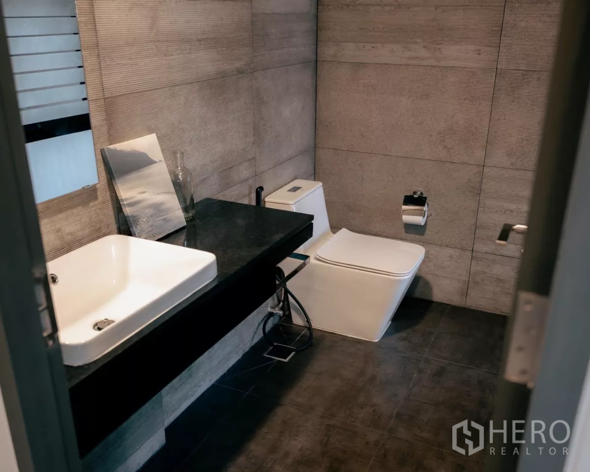 Detached House for rent or sale in Bang Phli, Samut Prakan - Alternate view of powder room with toilet and large mirror.