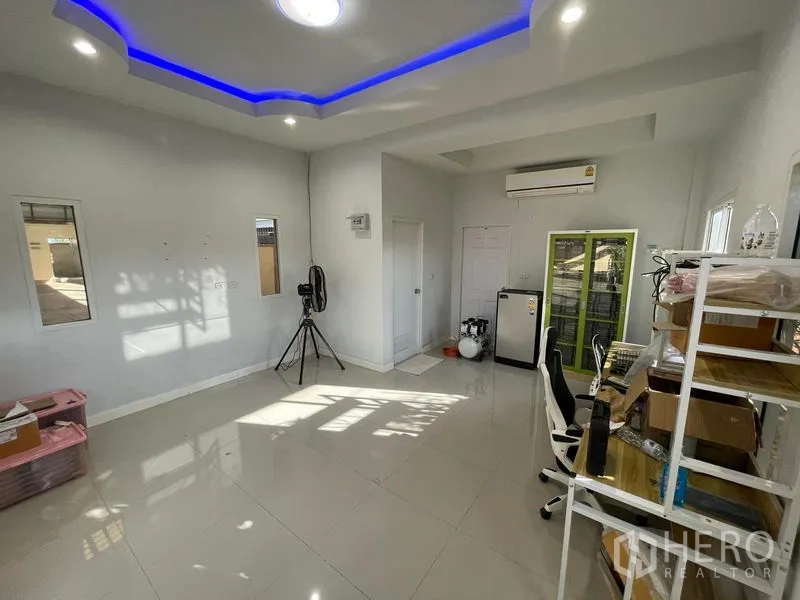 Factory for rent in Lat Lum Kaeo, Pathum Thani - Bright office room with AC, glossy tiles and blue LED ceiling lighting.