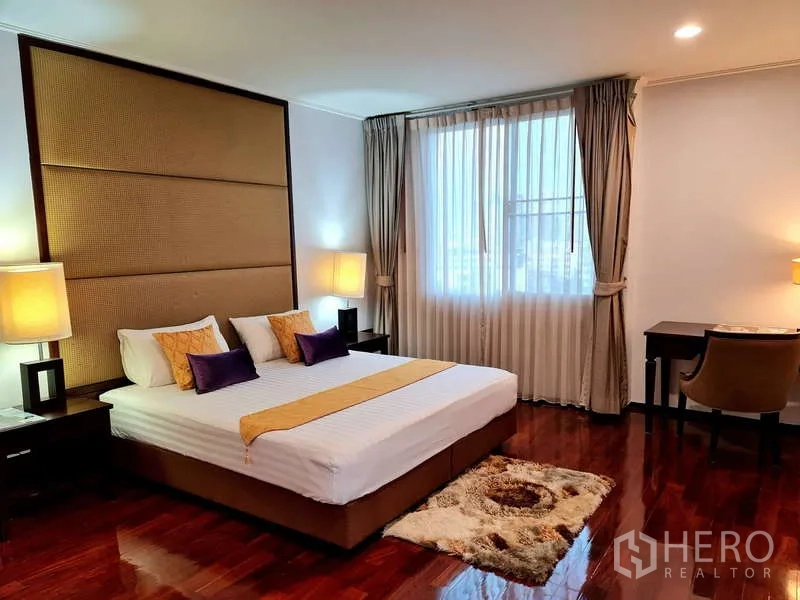 Apartment for rent - Master bedroom with king bed, oversized headboard, desk and window light.