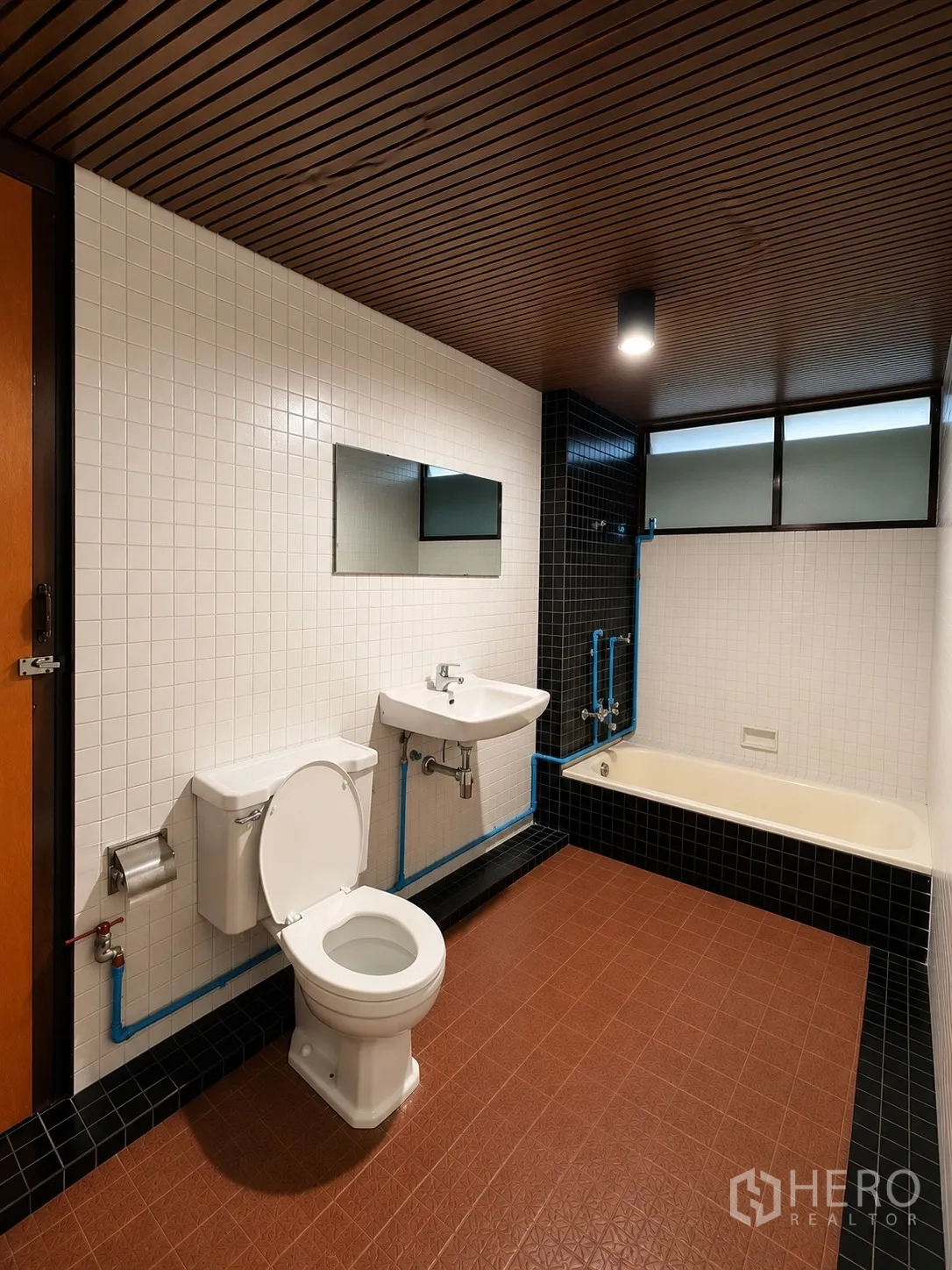 Office Space for rent in Phaya Thai, Bangkok - Bathroom with bathtub, toilet, twin sinks, and tiled walls.