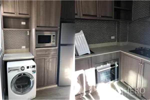 Townhouse for rent in Yan Nawa, Bangkok - Modern U-shaped kitchen with grey wood cabinets, mosaic backsplash, built-in oven, gas hob, microwave, fridge and washing machine.