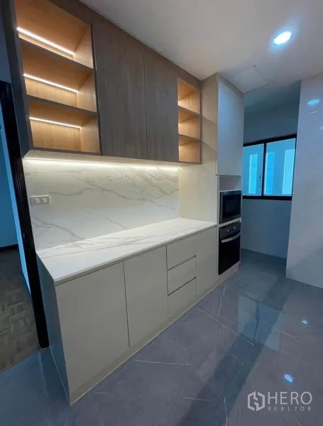 Condominium for rent - Kitchen pantry wall with open shelves and built-in oven tower.
