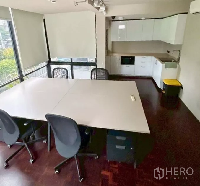 Retail Space for rent in Yan Nawa, Bangkok - Bright office area with meeting table, pantry cabinetry, and large windows.