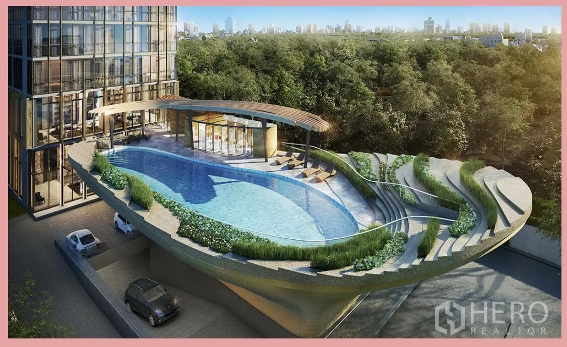 Condominium for sale in Watthana, Bangkok - Aerial view of a resort-style elevated swimming pool with curved terraces and lush planting beside the tower.