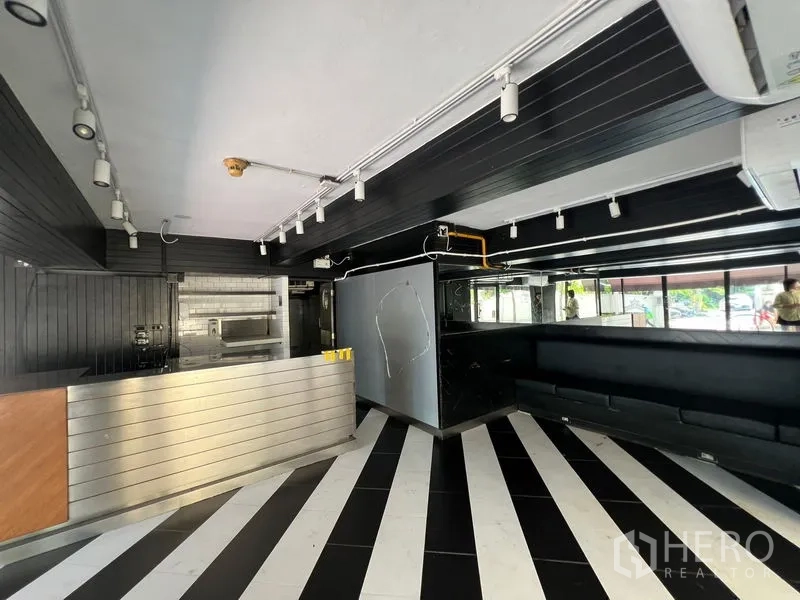 Retail Space for rent in Bang Rak, Bangkok - Sales area with bench seating, exposed utilities, and track lights.
