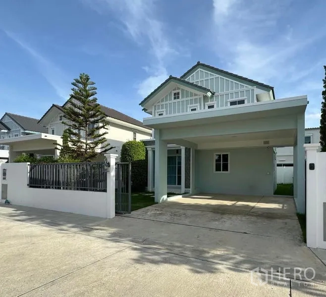 Detached House for rent - Front facade of the detached home showing gated driveway and covered parking.