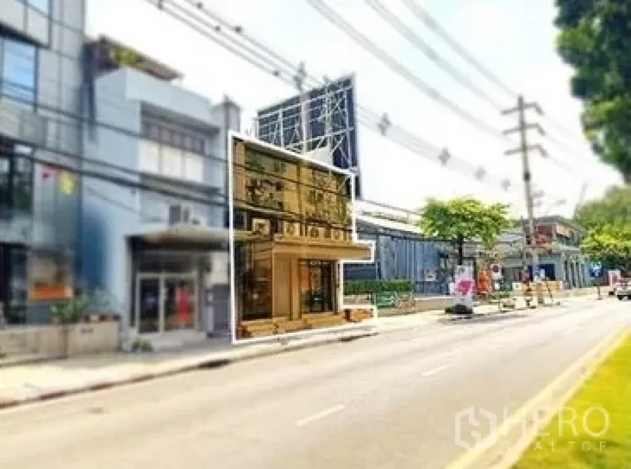 Retail Space for rent in Khlong Toei, Bangkok - Street view of a two-storey glass storefront with wide sidewalk near transit.