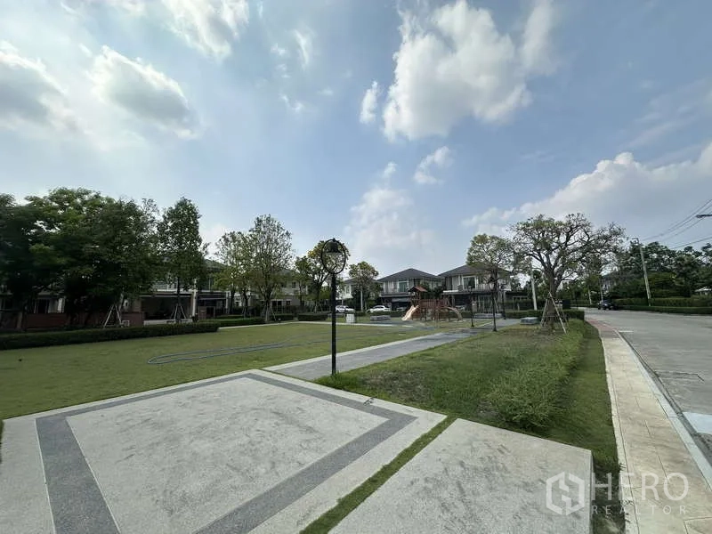Detached House for sale in Sai Mai, Bangkok - Community park with lawn, paths and a children’s playground.