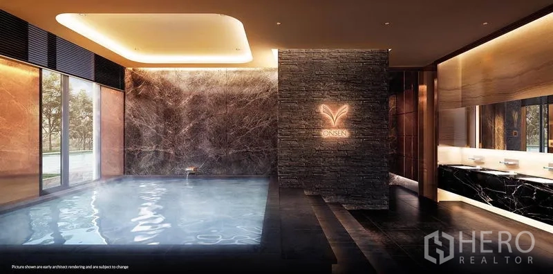 Condominium for rent in Khlong Toei, Bangkok - Indoor onsen-style spa pool with dark stone finishes and warm lighting.