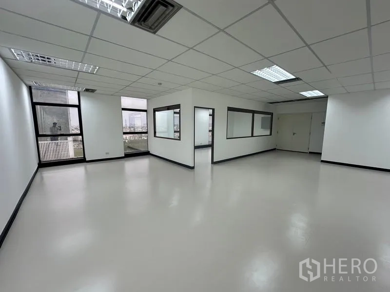 Office Space for rent - Corner office area with internal glass partitions and city views.
