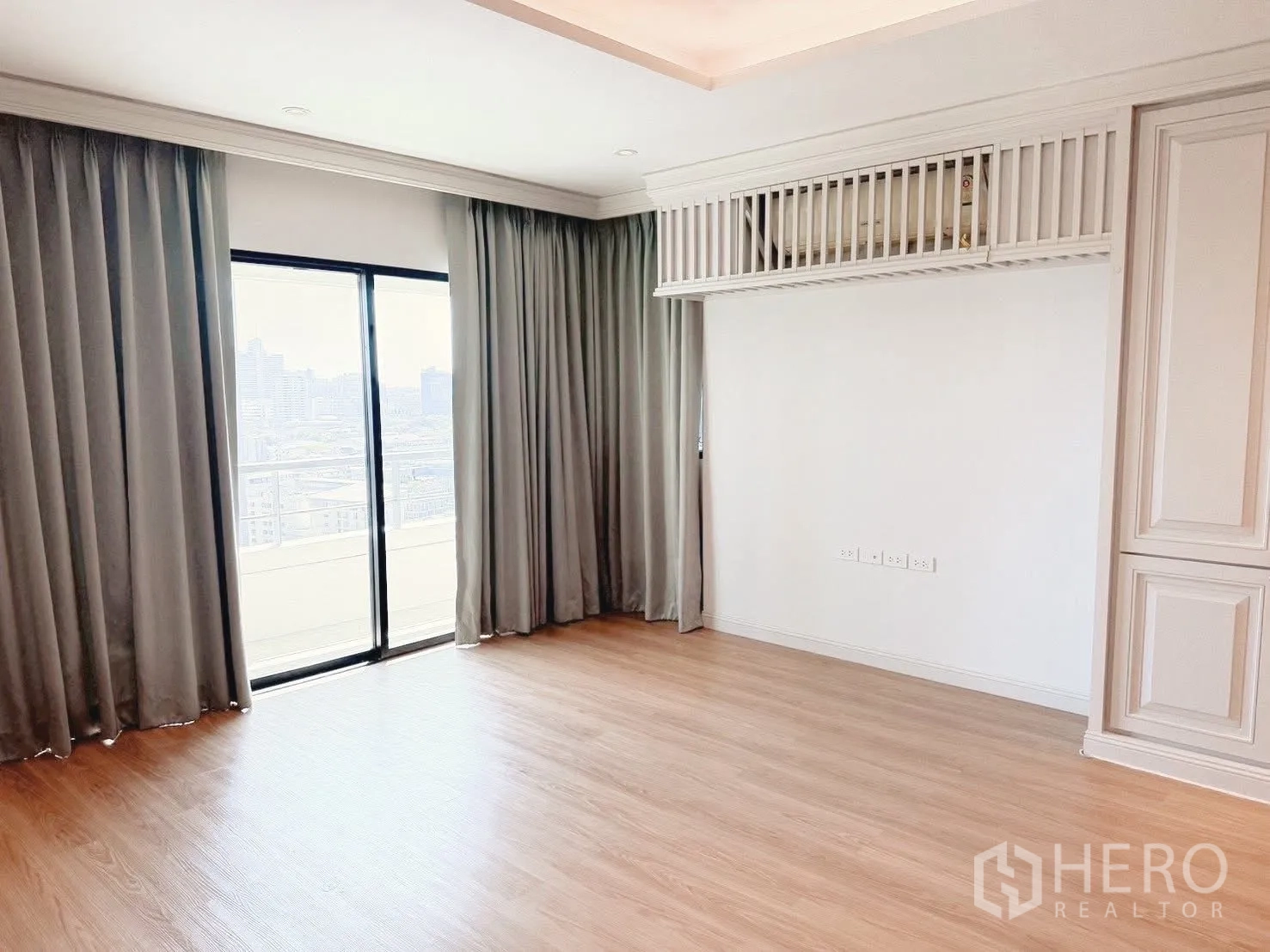 Condominium for rent or sale in Sathon, Bangkok - Bedroom with wood flooring, full curtains and sliding door to the balcony.