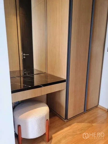 Condominium for sale - Open-plan dining and living area leading to a balcony with city views.