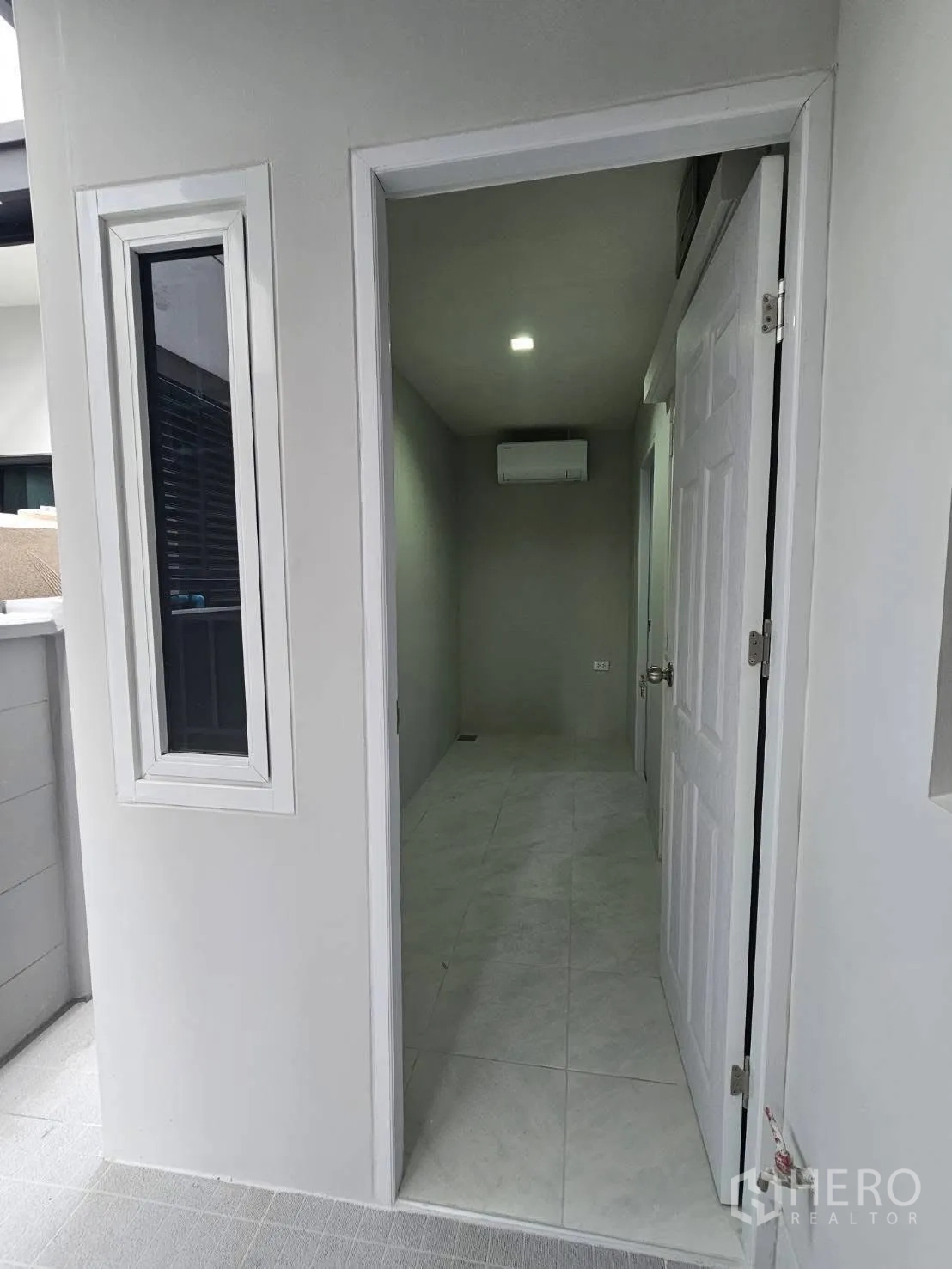 Detached House for rent or sale in Bang Phli, Samut Prakan - Entrance to a small air-conditioned utility room from the outdoor area.