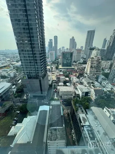 Condominium for rent or sale - High-floor city view overlooking mixed residential and office buildings in the Sathorn area.
