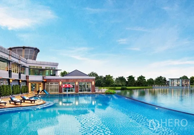 Detached House for sale in Lat Krabang, Bangkok - Lakeside clubhouse with a large resort-style swimming pool under a clear blue sky.