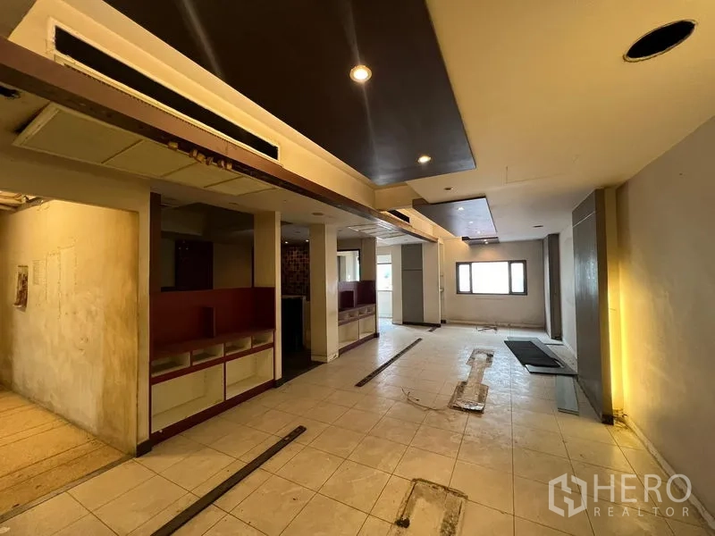 Shophouse for sale in Bang Rak, Bangkok - Open-plan upper floor with drop ceiling and recessed lights ready for fit-out.