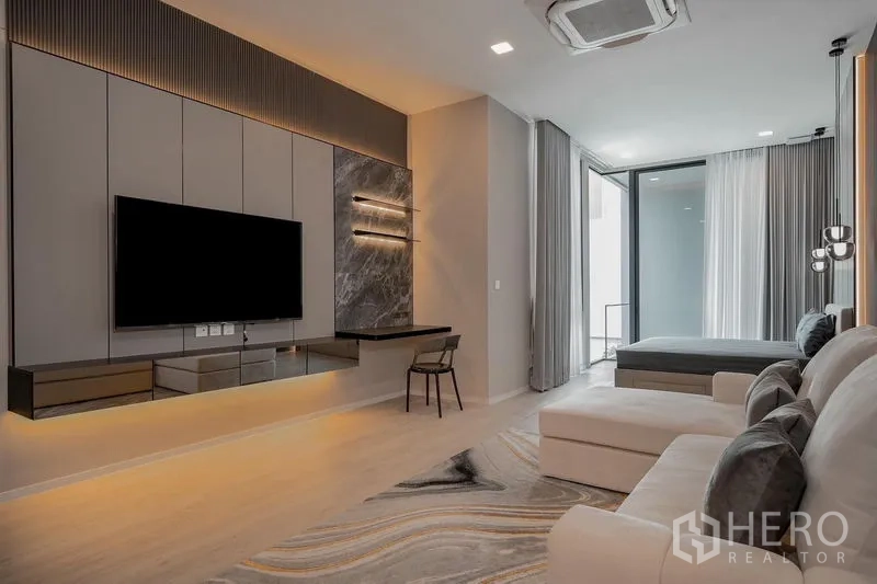 Detached House for rent - Private lounge with TV wall, desk, sectional sofa and access to the bedroom.