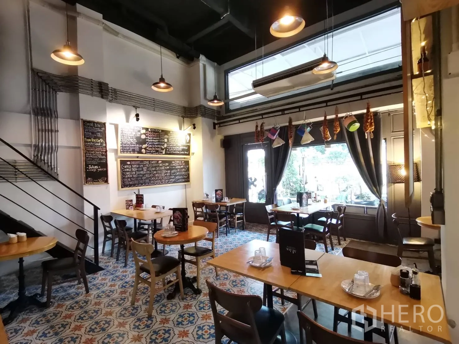 Retail Space for rent in Watthana, Bangkok - Bright eatery interior with pendant lights, large windows and menu boards.