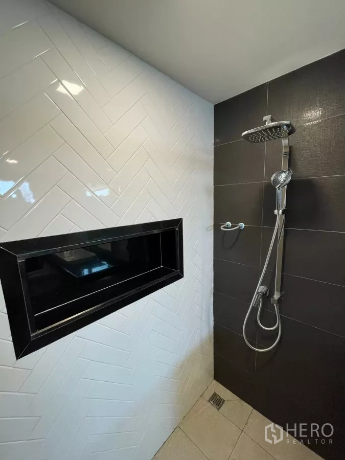 Home Office for rent in Khan Na Yao, Bangkok - Contemporary shower with rain head, handheld sprayer and white herringbone and dark wall tiles.